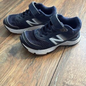 Navy new balance sneakers